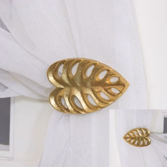 Melody Maison Gold Monstera Leaf Metal Curtain Holdbacks, Pair of Wall Mounted Floral Holdbacks