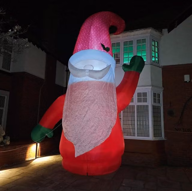 Samuel Alexander Giant 20ft Outdoor Inflatable Light Up Christmas Gonk with Raised Arm and LEDs in White, Red and Green – 1