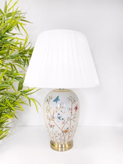 Downton Interiors Grey Butterfly Ceramic Table Lamp with White Pleated Fabric Shade and Gold/Brass Metal Details