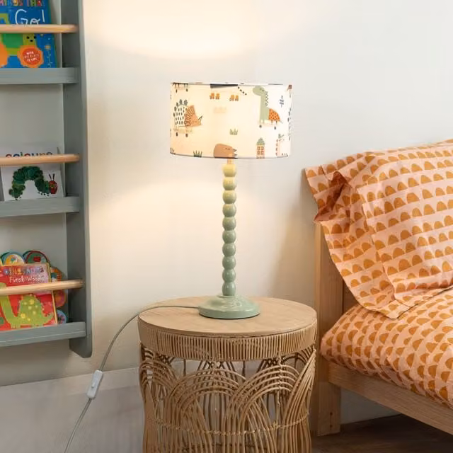 ValueLights Sage Green Bobbin Stem Table Lamp with Cartoon Dino Drum Shade