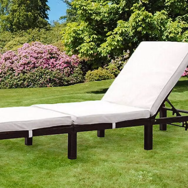Comfy Living Black Polyrattan Outdoor Reclining Sun Lounger with Cream Weatherproof Cushions and Adjustable Headrest