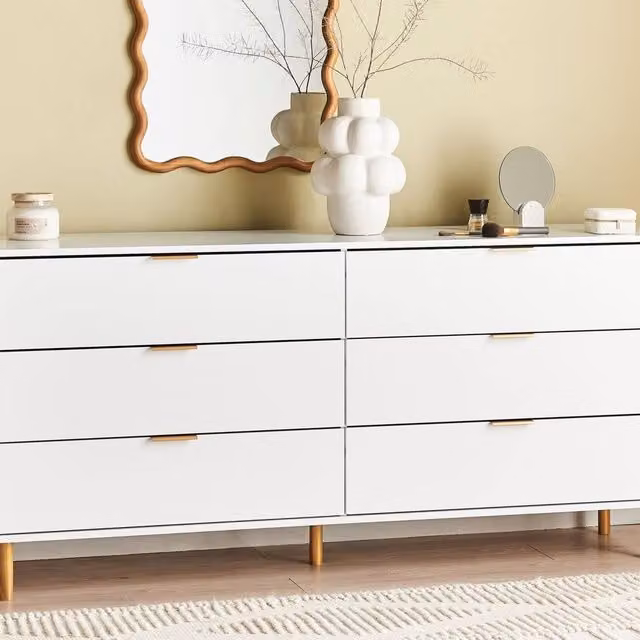 Wyld and Coco Home Modern 6-Drawer Chest in White with Gold Accents and Pine Wood Legs