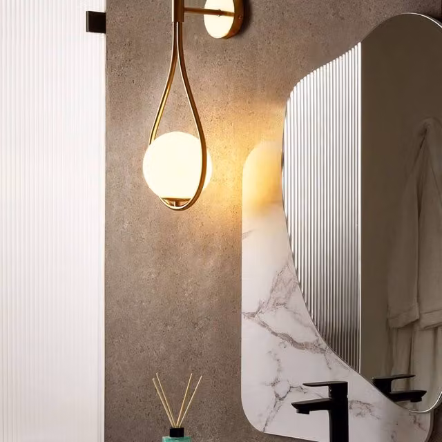 Wyld and Coco Gold Wall Lamp with Transparent Tear Shaped Glass Shade