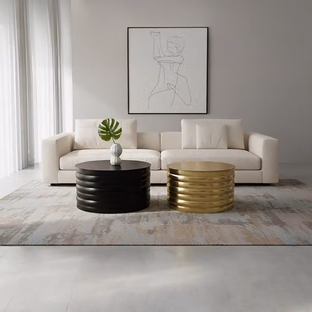 Fifty Five South Set of Two Round Nested Coffee Tables in Black and Gold Metal