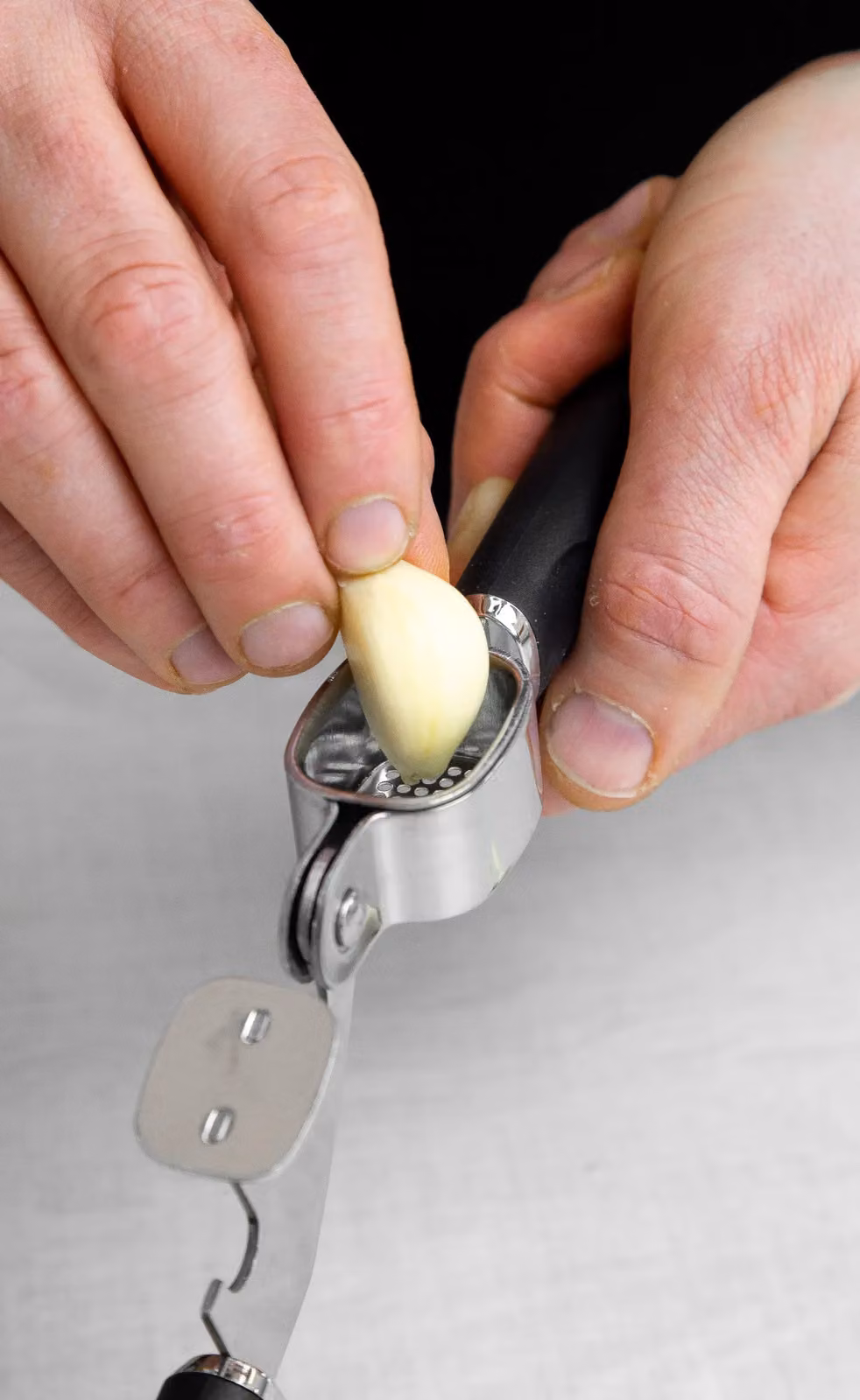 MasterClass Stainless Steel Garlic Press with Ergonomic Grip in Black – 7