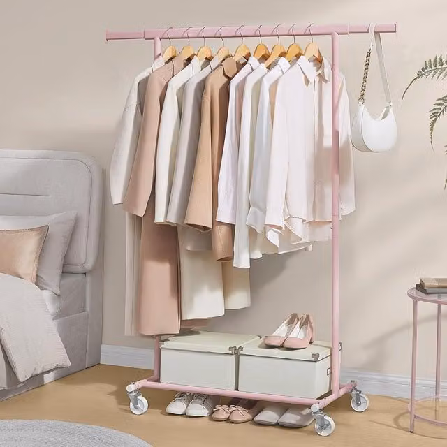 SONGMICS Portable Clothes Rack on Wheels with Extendable Rail in Pink