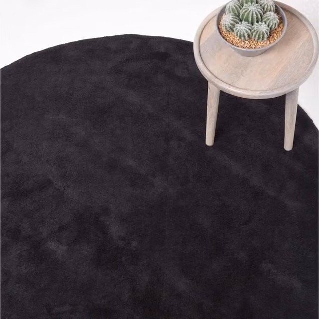 Homescapes Hand Tufted Plain Round Cotton Rug in Black