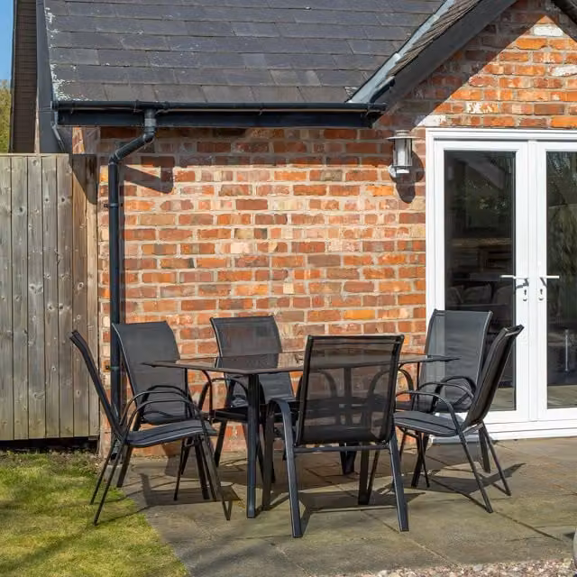 Samuel Alexander 6 Person Rectangular Glass Top Garden Patio Dining Set in Black