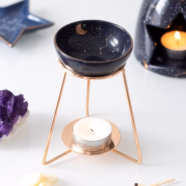 Something Different Purple and Gold Star Sign Ceramic Oil Burner with Metal Base W: 10 cm, D: 10.5 cm, H: 10.5 cm
