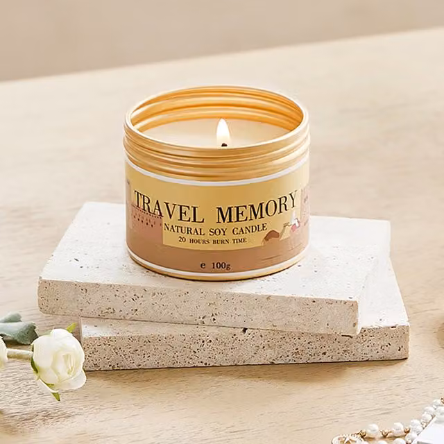 Komore Baltic Amber Scented Soy Wax Candle in a Gold Metal Jar