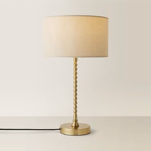 ValueLights Maeve Fabric Drum Table Lamp with Brushed Gold Bobbin Detail in Beige and White – 1