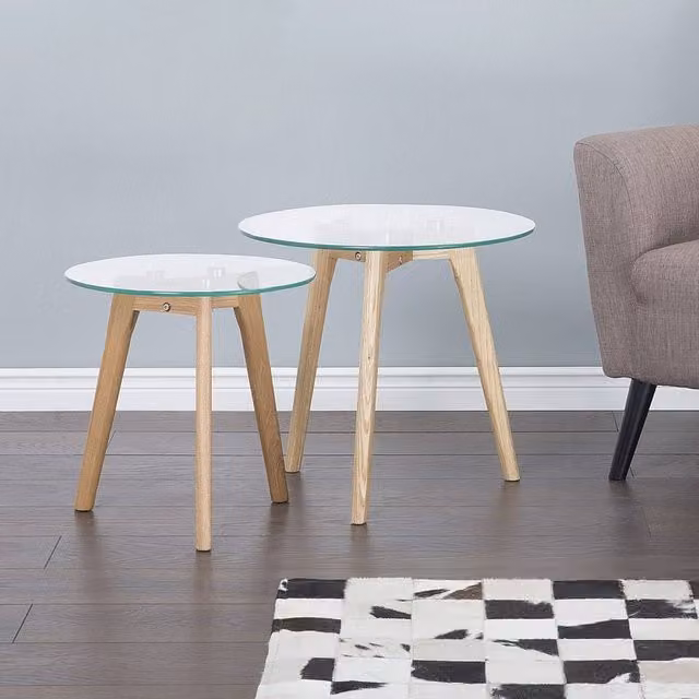 Wyld and Coco Nest of 2 Round Glass Top Tables with Light Oak Legs in Clear – 1