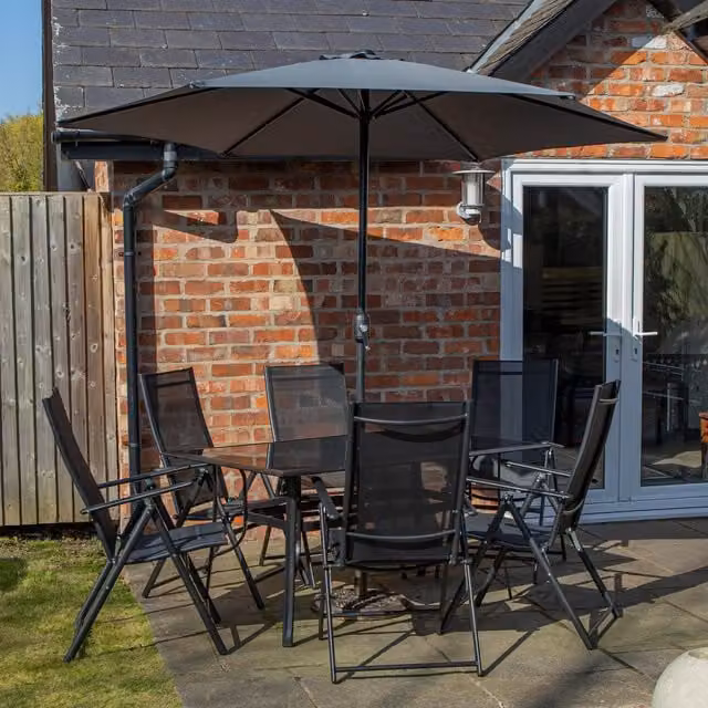 Samuel Alexander Modern 6 Person Glass and Metal Garden Patio Dining Table and Chairs Set in Black and Grey