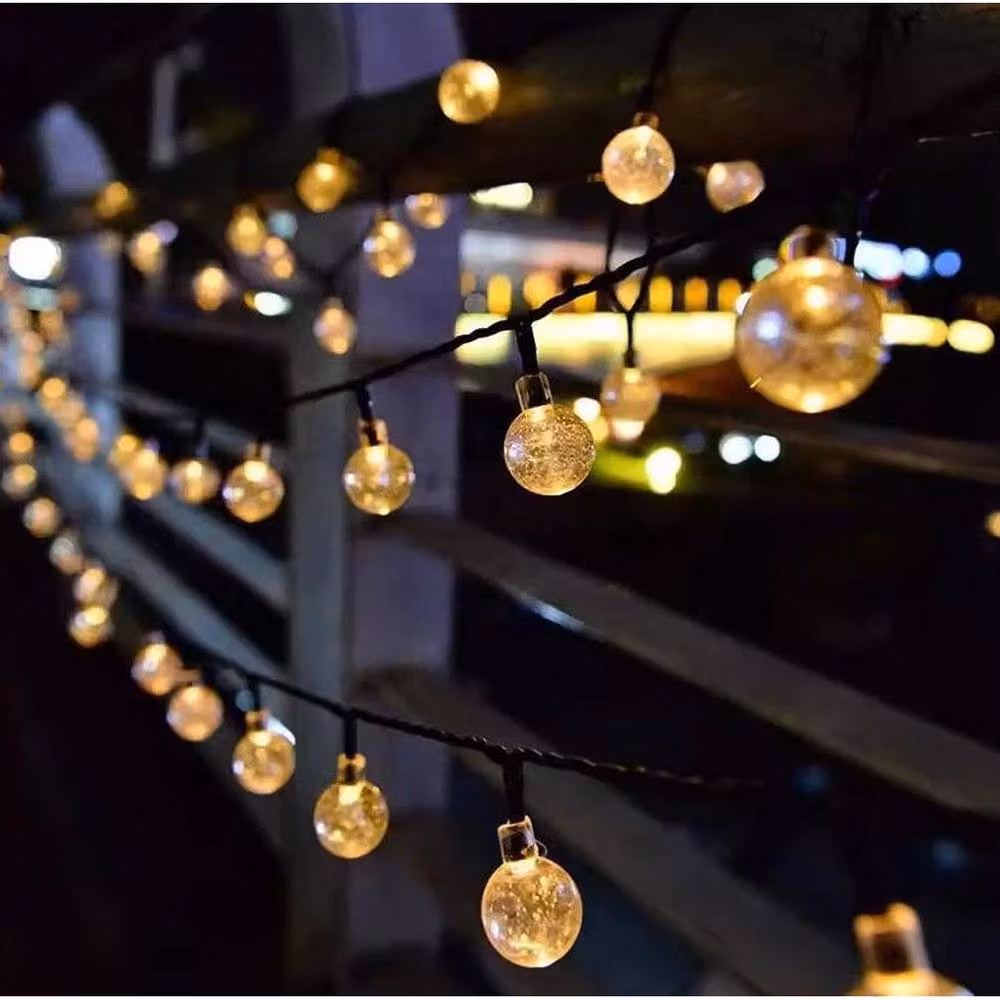 NESTLUNE 130 LED Solar Powered Waterproof Fairy Lights in Black with Warm White Sphere Bullets and Dusk Sensor, 15m – 6