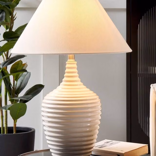 Wyld and Coco Carved Beige Ceramic Table Lamp with Fabric Shade – 1