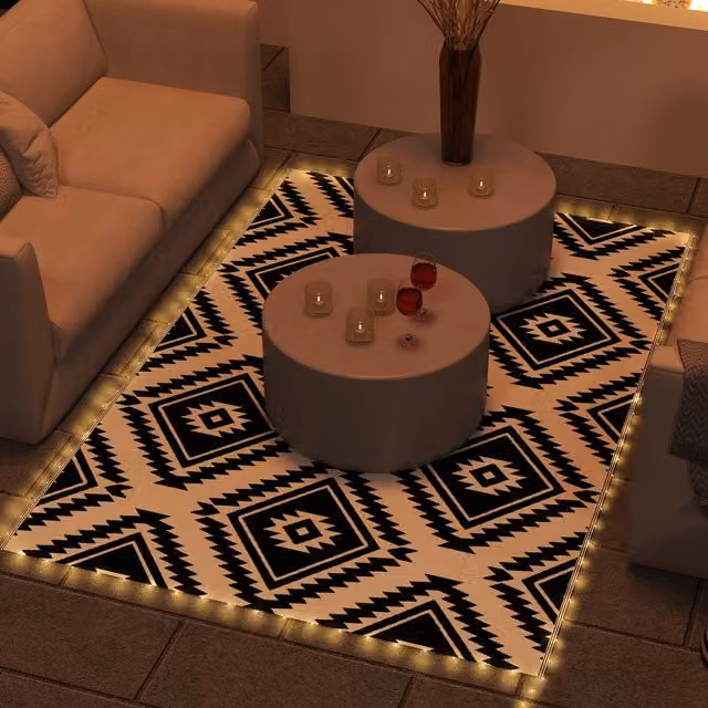 Outsunny Reversible Geometric Boho Outdoor RV Rug with LED String Lights in Brown, Black and White