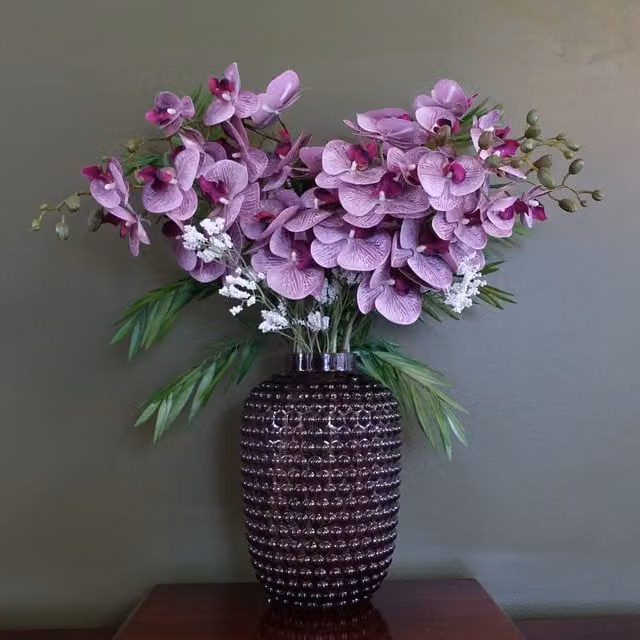 Amethyst Artificial Purple Orchid and Leaf Arrangement in a Round Geometric Glass Vase