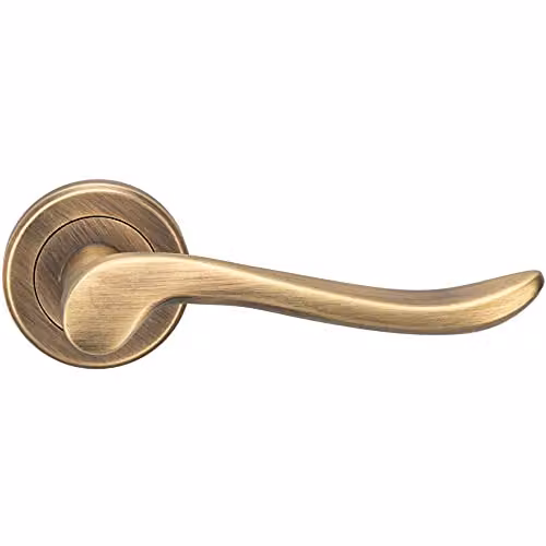 Loops Pair of Scroll Shaped Lever Handles on Round Rose in Antique Brass with Concealed Fixings