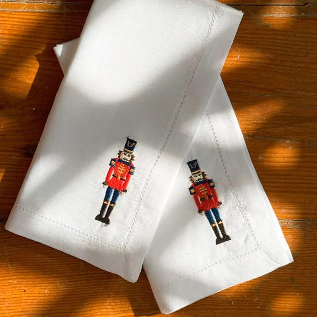 Mafra White Cotton Christmas Table Linen with Embroidered Nutcrackers W/D/H: 50 x 50 x 4 cm