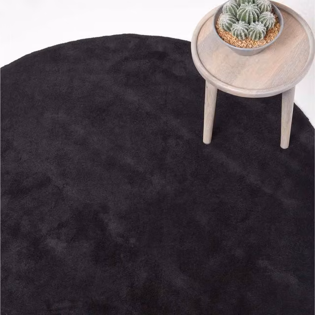 Homescapes Hand Tufted Plain Round Cotton Rug in Black