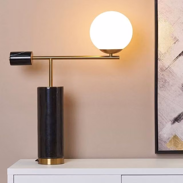 Wyld and Coco Modern Table Lamp with Black Marble Base, Gold Arm and Transparent Glass Sphere Shade