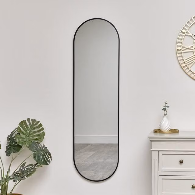 Melody Maison Modern Black Oval Framed Wall Mirror W: 140 cm, H: 40 cm