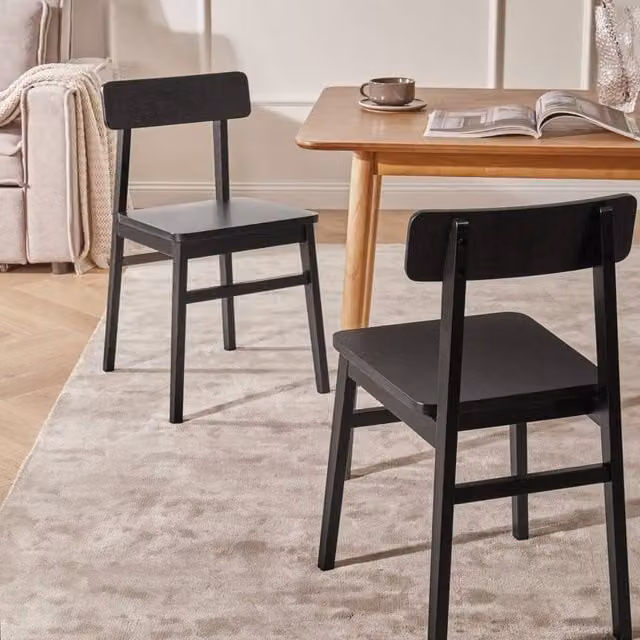 Wyld and Coco Set of 2 Black Lacquered Rubberwood Dining Chairs in a Classic Style