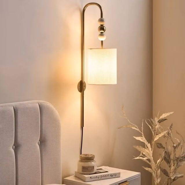 Wyld and Coco Mid Century Wall Lamp with Beige Fabric Drum Shade and Brass Finish – 1