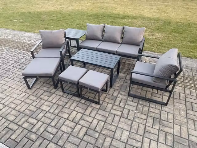 Fimous 8 Piece Aluminium Garden Furniture Set in Dark Grey with Cushions, 2 Seater Sofa, 2 Armchairs, 3 Ottomans and Coffee Table