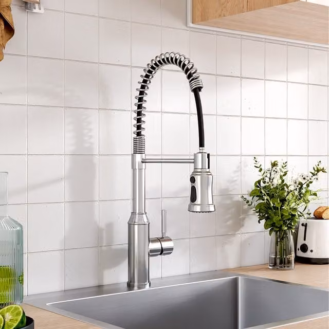Chrome Stainless Steel Kitchen Faucet with Swivel Spout and Spray Function in Silver