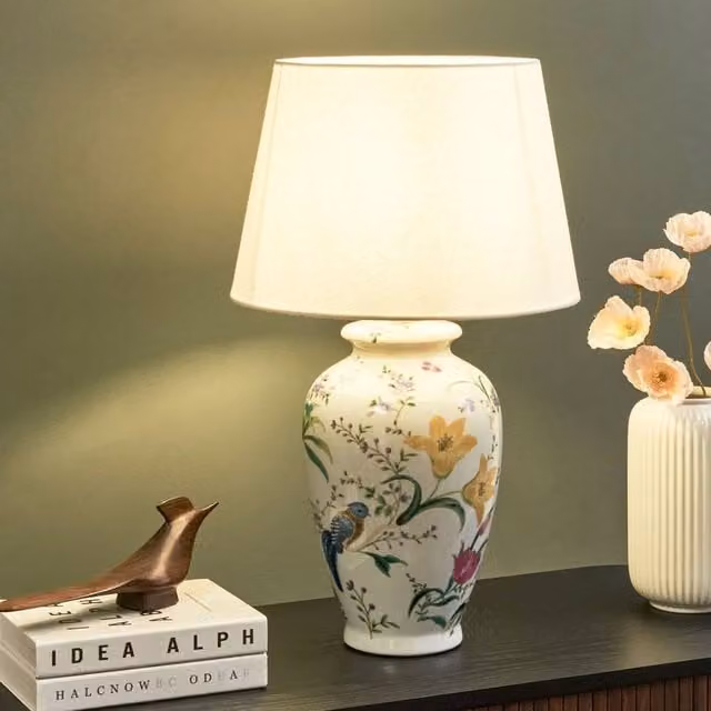 Wyld and Coco White Ceramic Floral Table Lamp with Fabric Cylinder Shade – 1