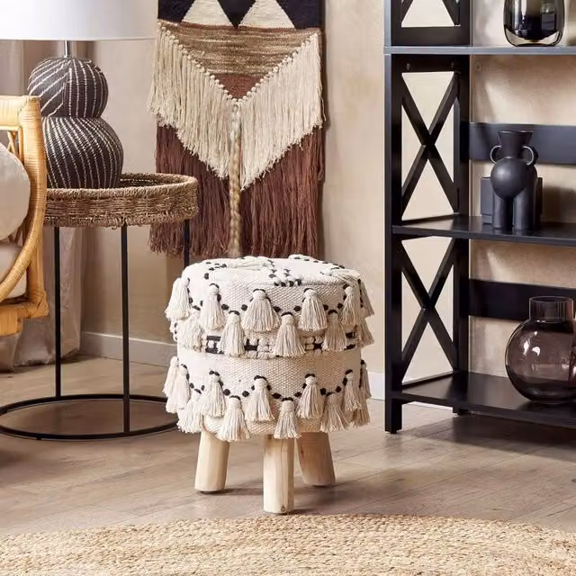 Wyld and Coco Beige Boho Cylindrical Footstool with Black Cotton Knit Tassels and Wood Frame – 1
