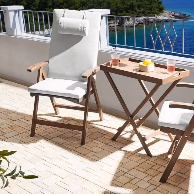 Wyld and Coco 2-Piece Foldable Acacia Wood Garden Chairs with Off-White Cushions in Brown – 1