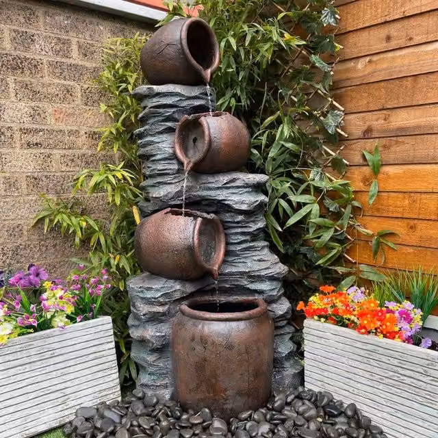 Tranquility 4 Pouring Jugs on Rock Solar Powered Cascade Water Feature in Grey