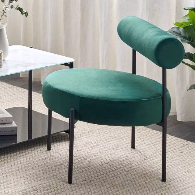 Wyld and Coco Emerald Green Velvet Armless Tub Chair with Black and Green Roll Back Bolster – 1