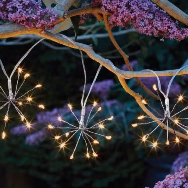 Garden Mile Star Burst Solar LED String Lights with Warm White Glass Bulbs in Transparent