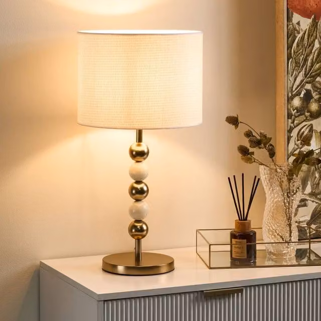 Wyld and Coco Mid-Century Table Lamp with Gold Brass Base and Beige Fabric Drum Shade