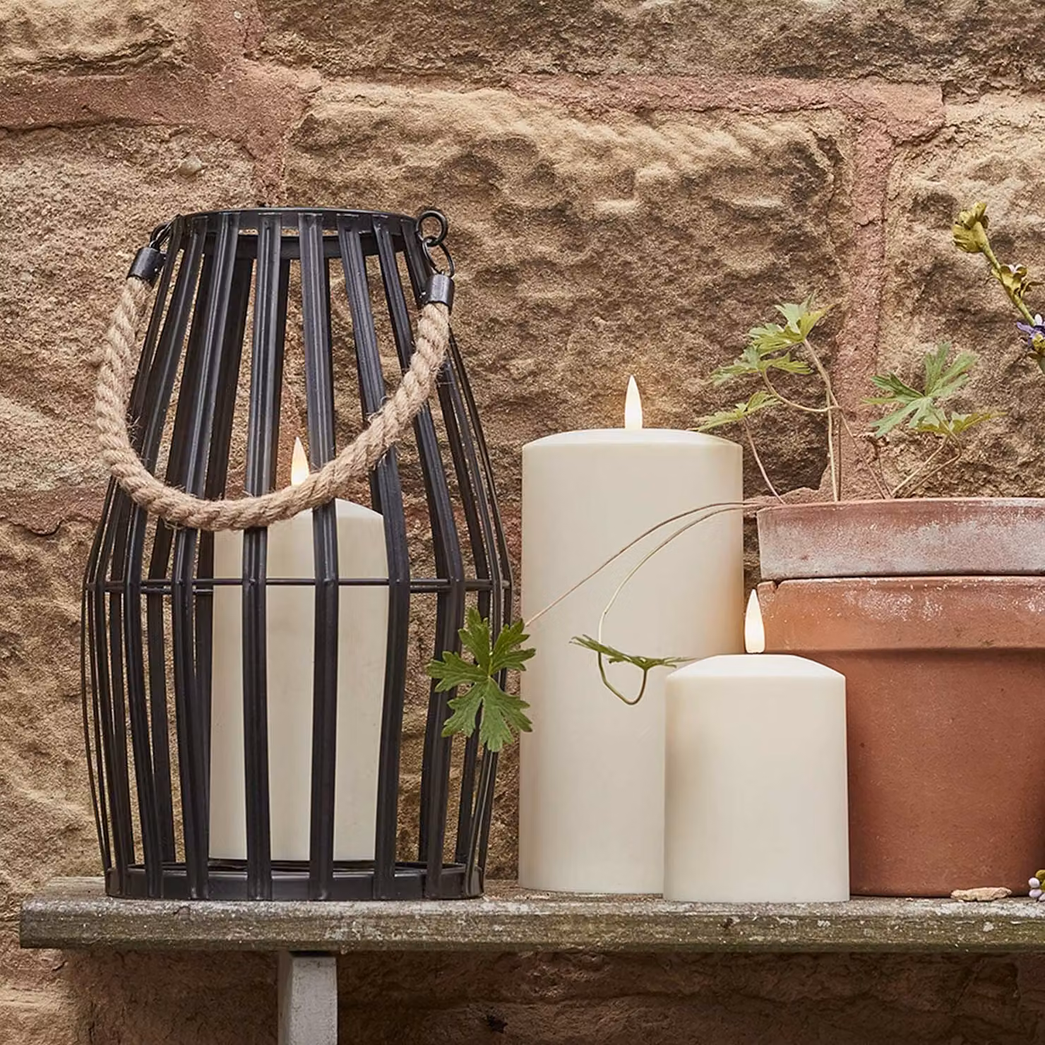 Lights4fun Black Slatted Metal Garden Lantern and LED TruGlow Pillar Candle Bundle with Timer and Flicker Effect, Height: 29 cm