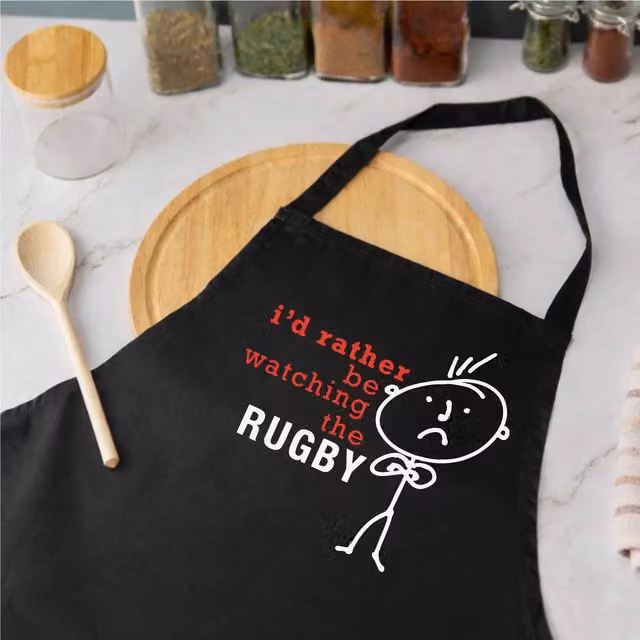 60 Second Makeover Men's I'd Rather Be Watching The Rugby Apron in Black